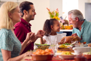 multi generation family celebrating thanksgiving